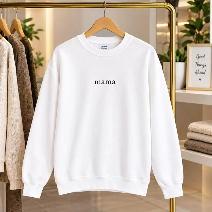 White Mama sweatshirt displayed on a gold boutique rail